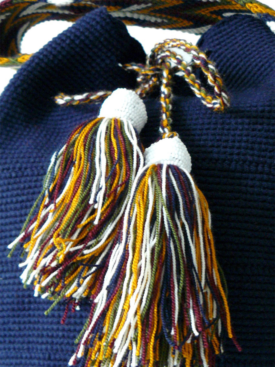 Dark blue and mustard Tassels with white beads of the Dark blue woven shoulder bag Palmazul Beachwear Wayuu Mochila
