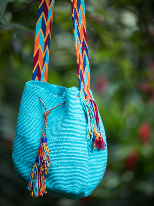 Turquoise woven shoulder bag with tassels and beads Palmazul Beachwear Lifestyle Wayuu Mochila