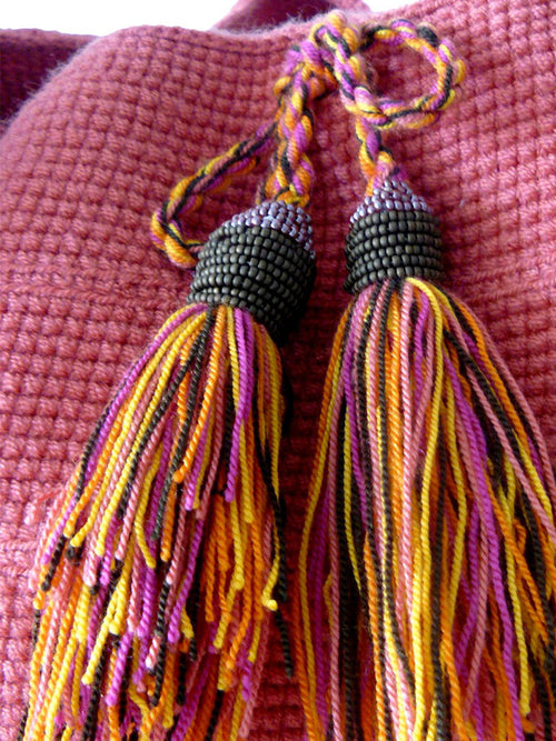 Orange, yellow, brown and pink Tassels with brown beads of the Pink woven shoulder bag Palmazul Beachwear Wayuu Mochila