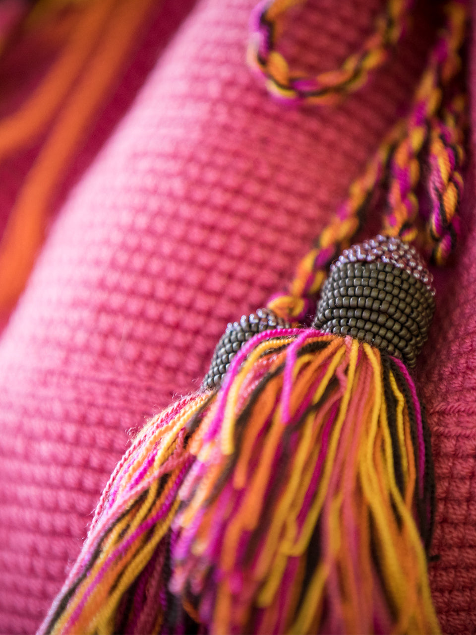 Pink woven shoulder bag with tassels and beads Palmazul Beachwear Lifestyle Wayuu Mochila