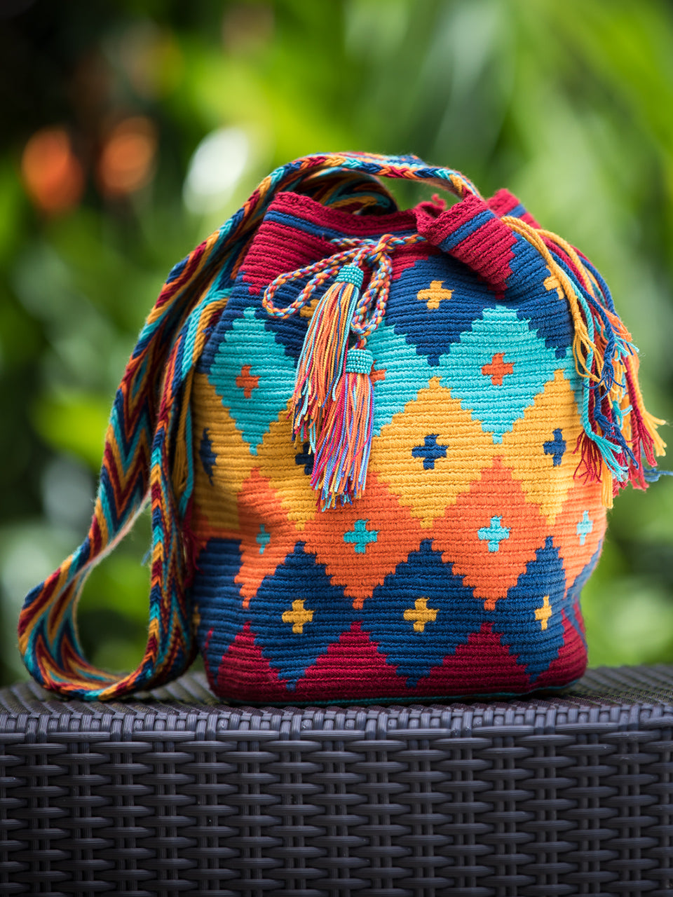 Diamond pattern orange, yellow, red and blue woven shoulder bag with tassels and beads Palmazul Beachwear Lifestyle Wayuu Mochila