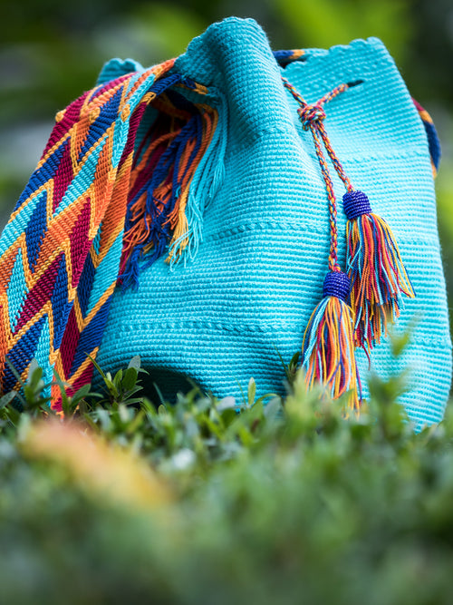 Turquoise woven shoulder bag with tassels and beads Palmazul Beachwear Lifestyle Wayuu Mochila