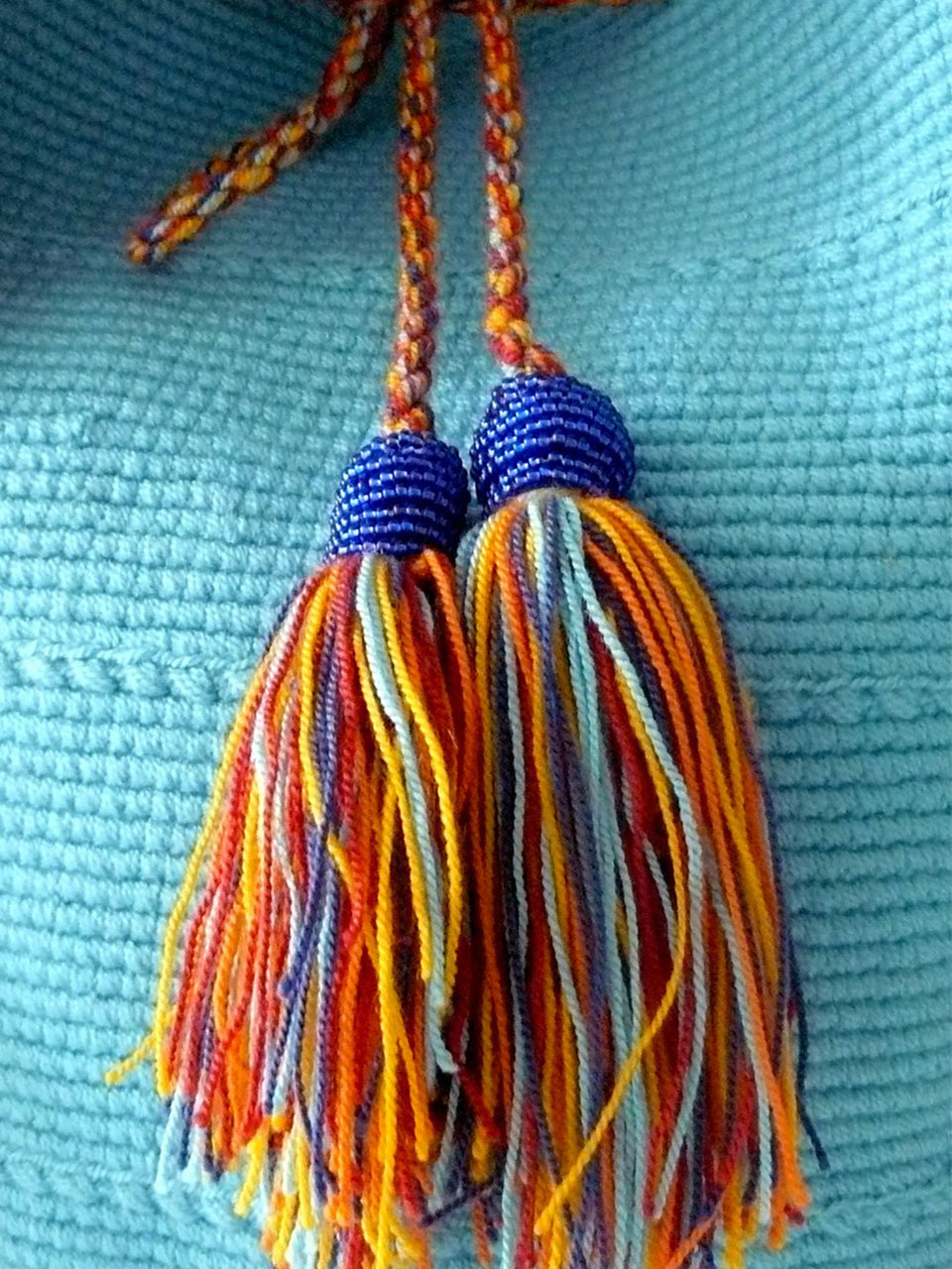 Turquoise, orange, yellow and blue Tassels with blue beads of the Turquoise woven shoulder bag Palmazul Beachwear Wayuu Mochila